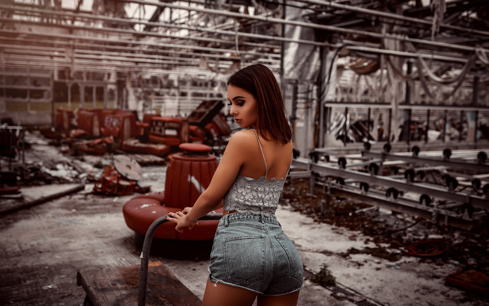 women, jean shorts, brunette, abandoned, red nails, back