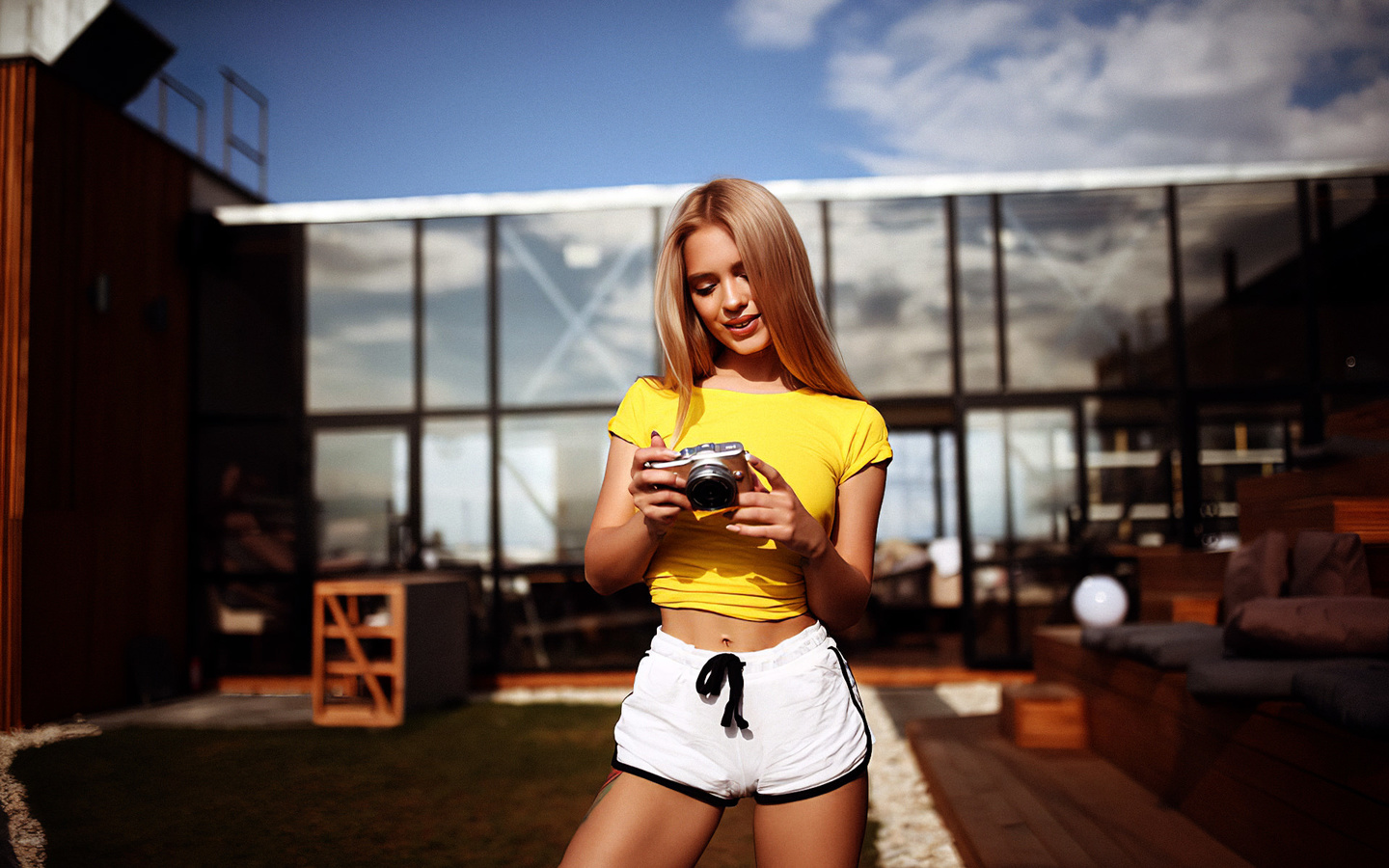 women, katya kotaro, blonde, brunette, camera, women outdoors, short shorts, yellow t-shirt, smiling, grass, belly, tattoo