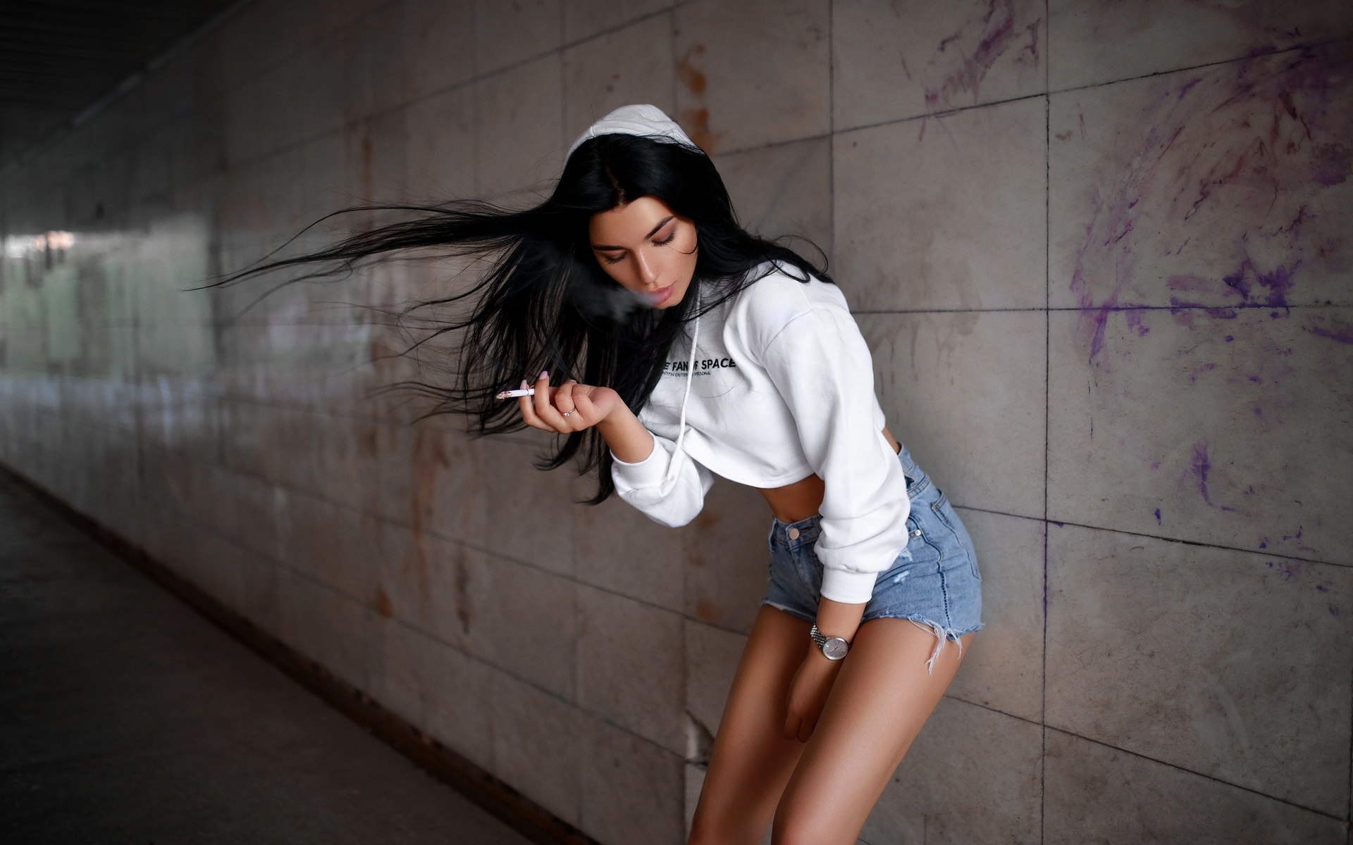 women, brunette, jean shorts, hoods, sweater, black hair, cigarettes, watch, straight hair, smoke, pink nails, closed eyes, wall