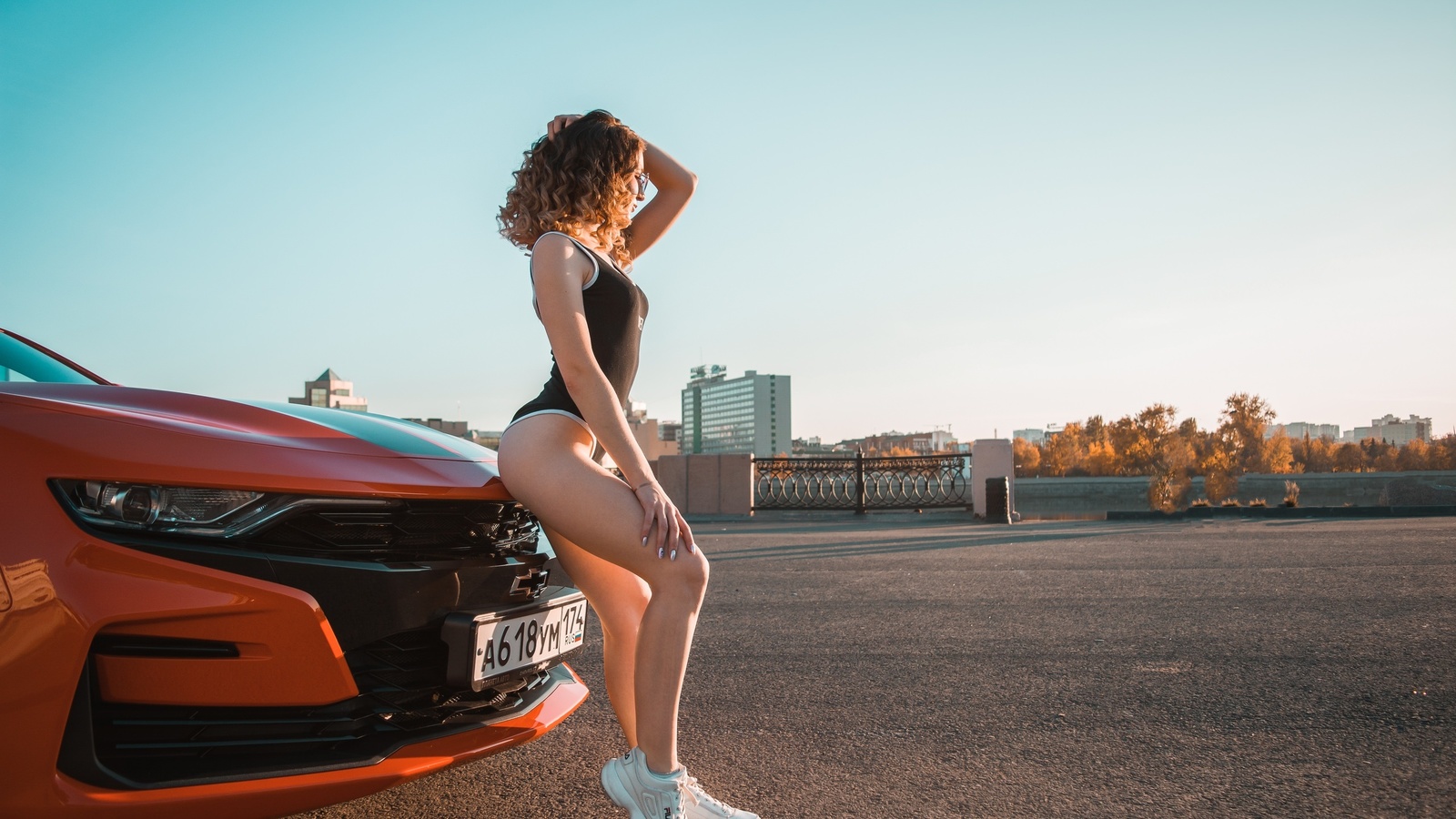 women, women with cars, ass, sneakers, fila, bodysuit, curly hair, women with glasses, sky, building, women outdoors, chevrolet