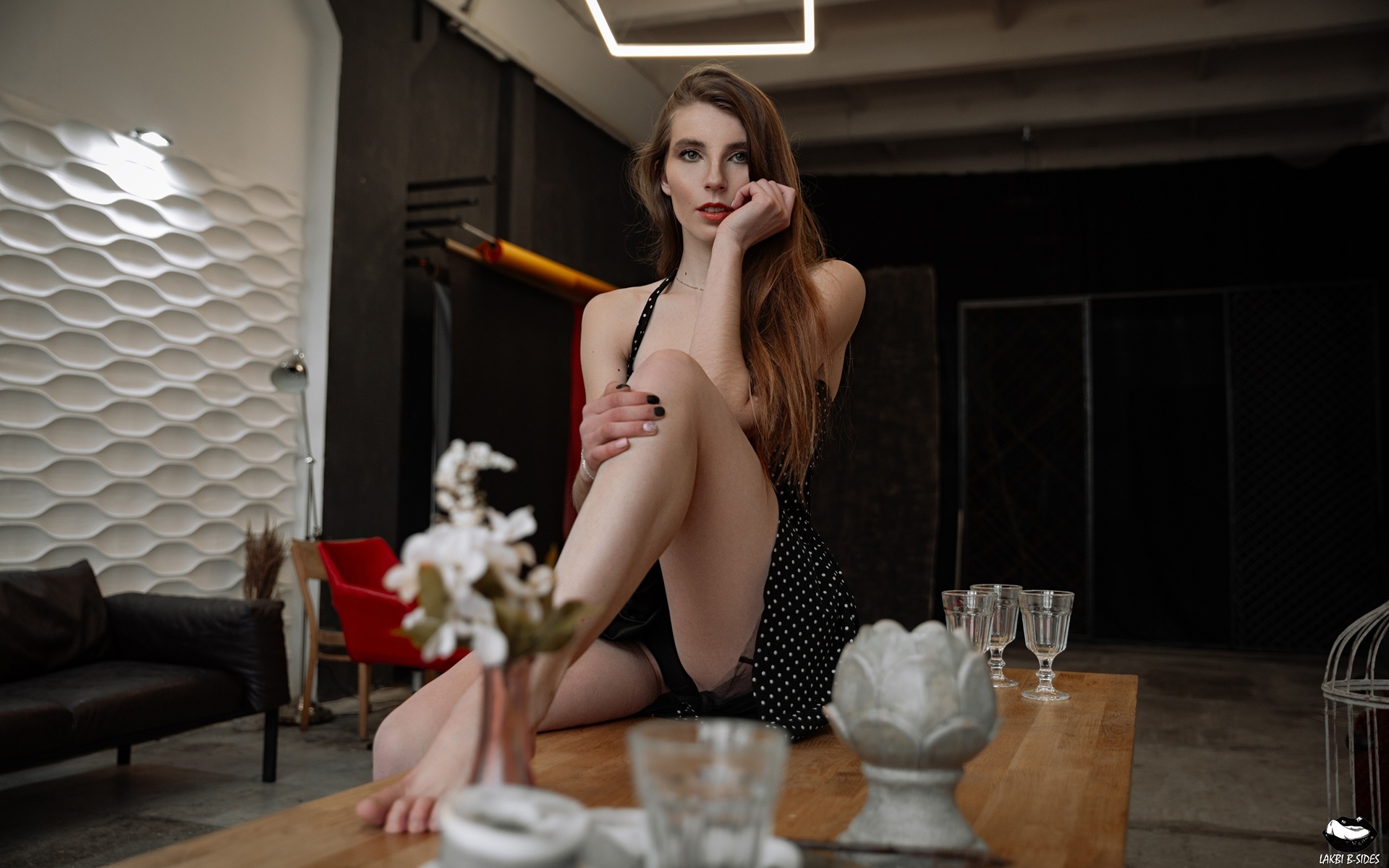 women, sitting, black panties, couch, women indoors, table, chair, drinking glass, dress, polka dots, painted nails, black dress, red lipstick