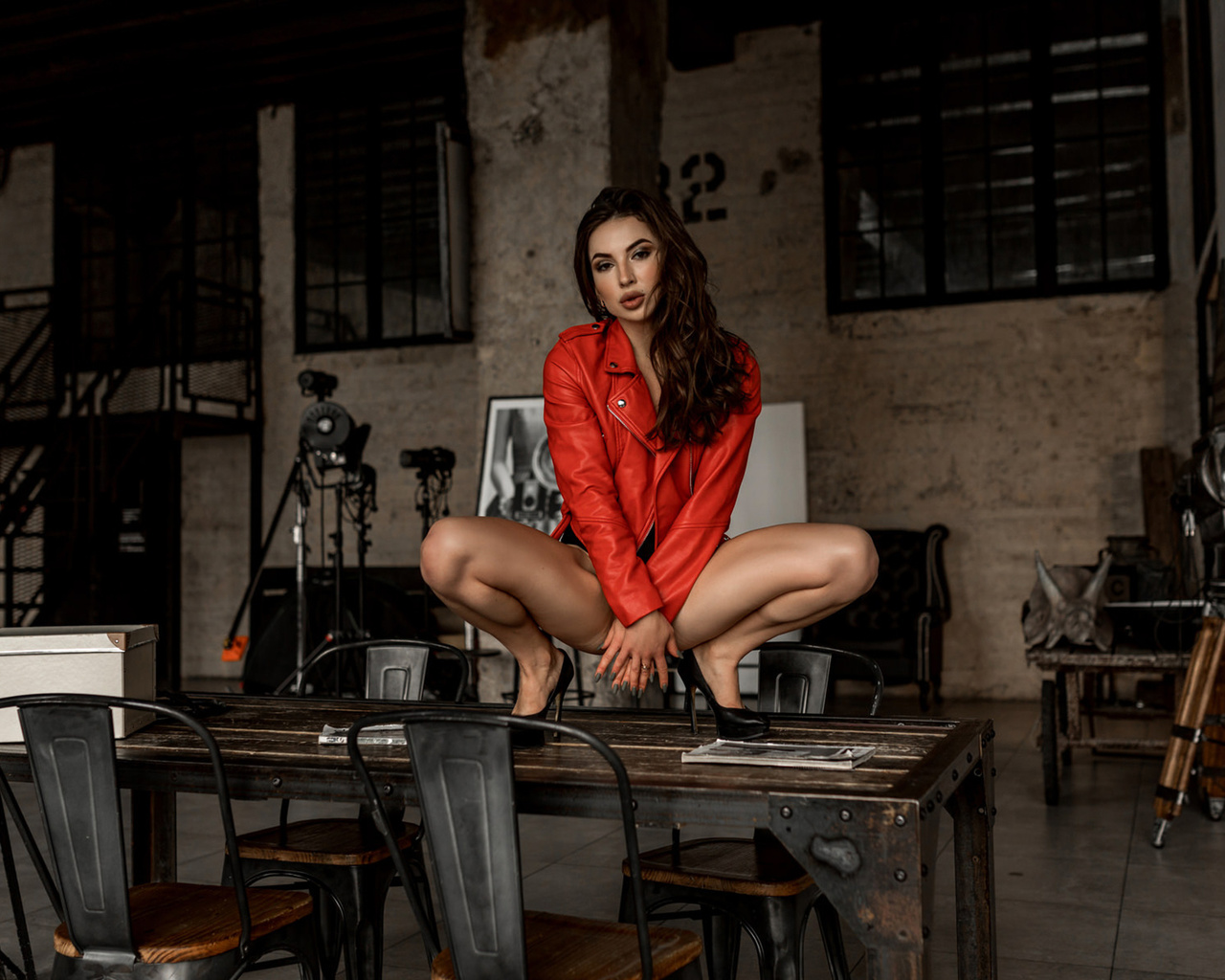 women, squatting, table, chair, leather jackets, red jackets, women indoors, high heels, brunette, stairs, window, strategic covering