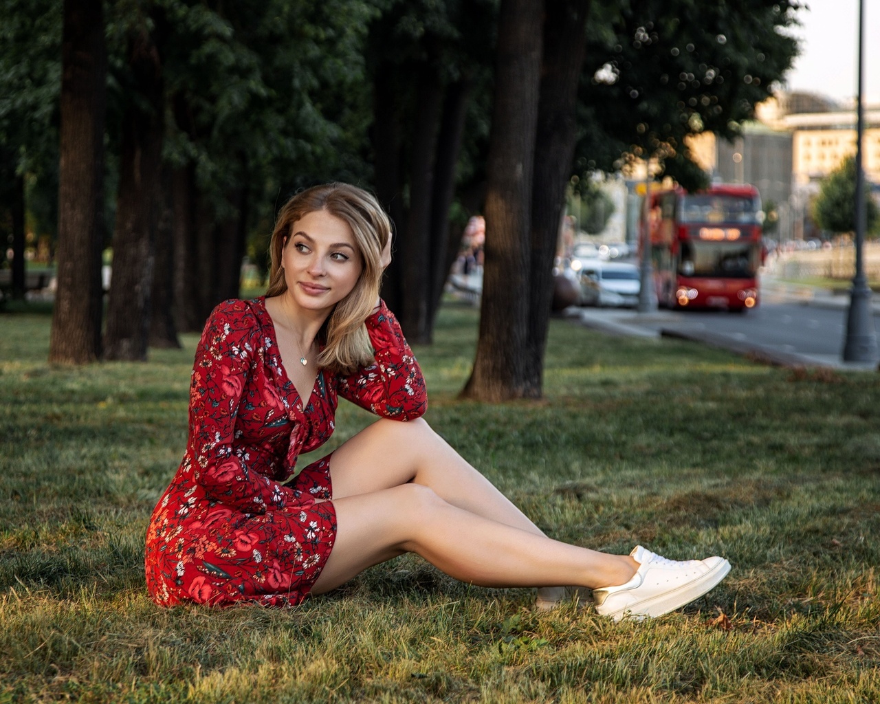 oleg klimin, model, brunette, dress, red dress, sitting, grass, sneakers, bus, street, trees, sunlight, sky, city