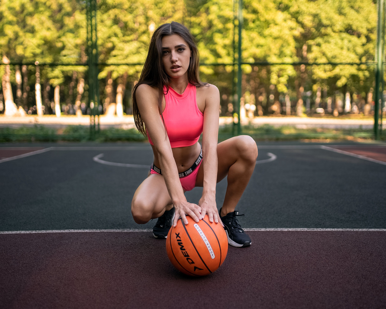 women, basketball court, sportswear, ball, women outdoors, sneakers, trees, squatting, belly, brunette