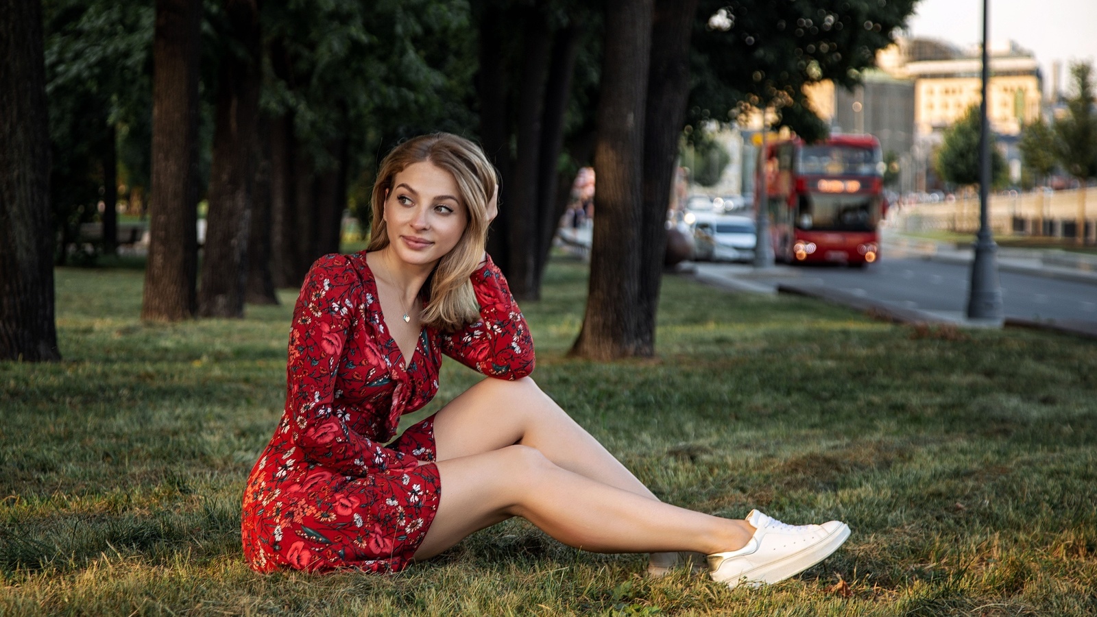 oleg klimin, model, brunette, dress, red dress, sitting, grass, sneakers, bus, street, trees, sunlight, sky, city