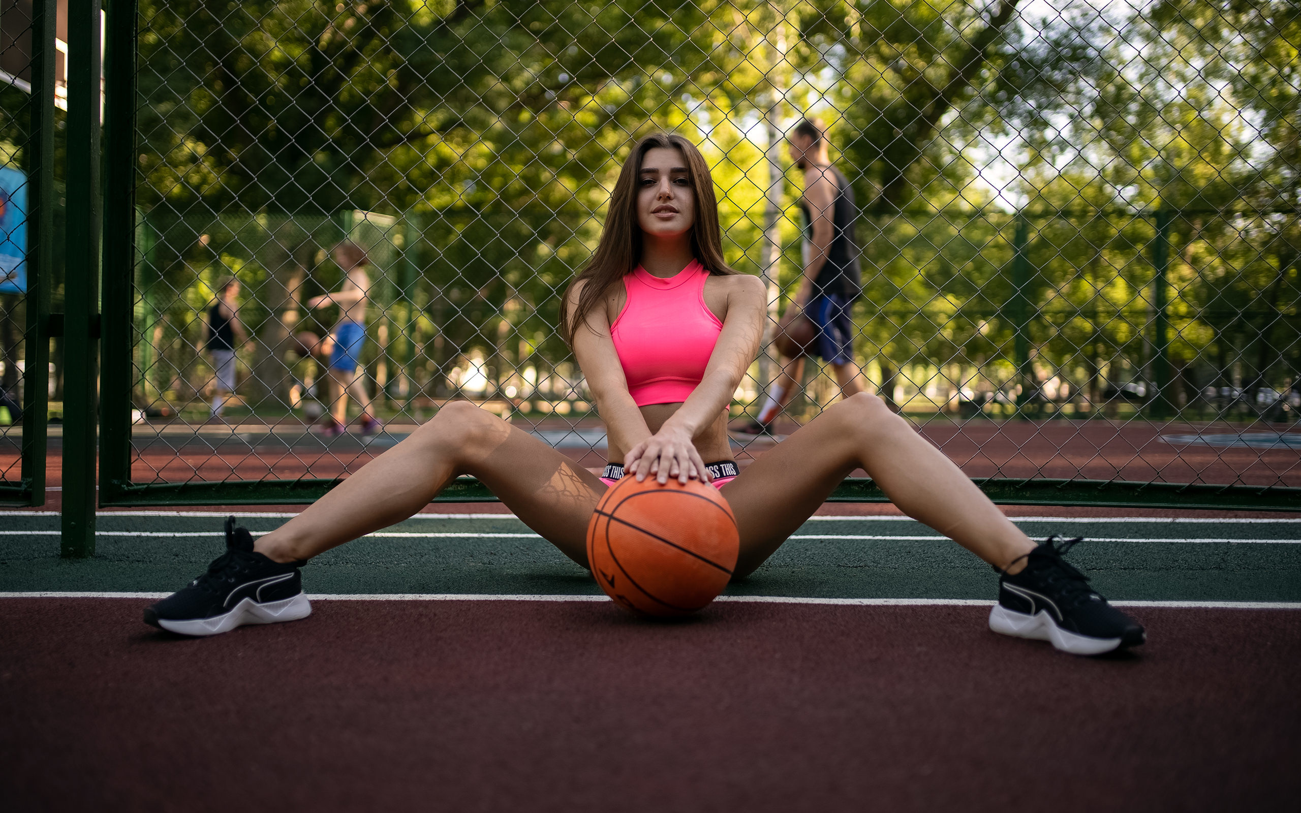 women, basketball court, balls, portswear, brunette, women outdoors, spread legs, sneakers, sitting, strategic covering, trees, smiling