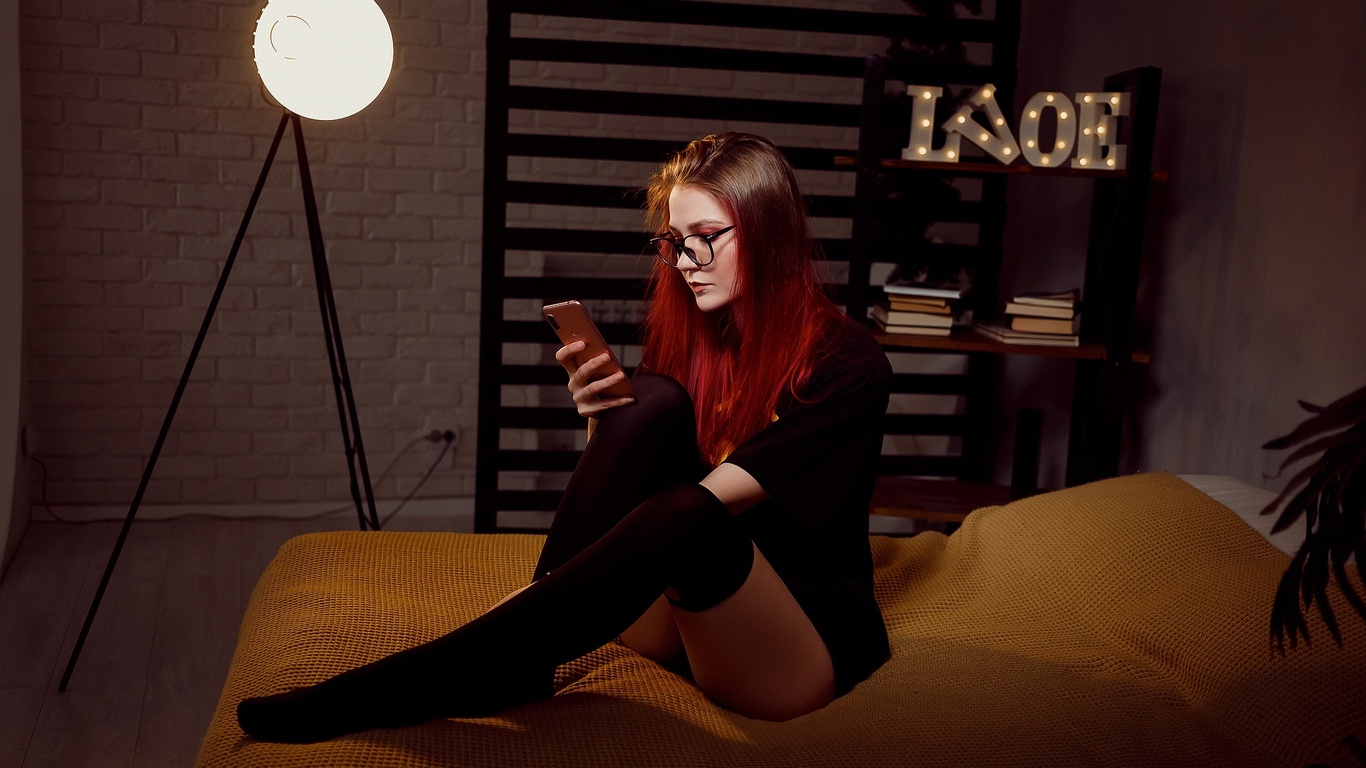 women, dyed hair, batman logo, in bed, black stockings, panties, sitting, glasses, wall, books, black t-shirt, cellphone, women with glasses