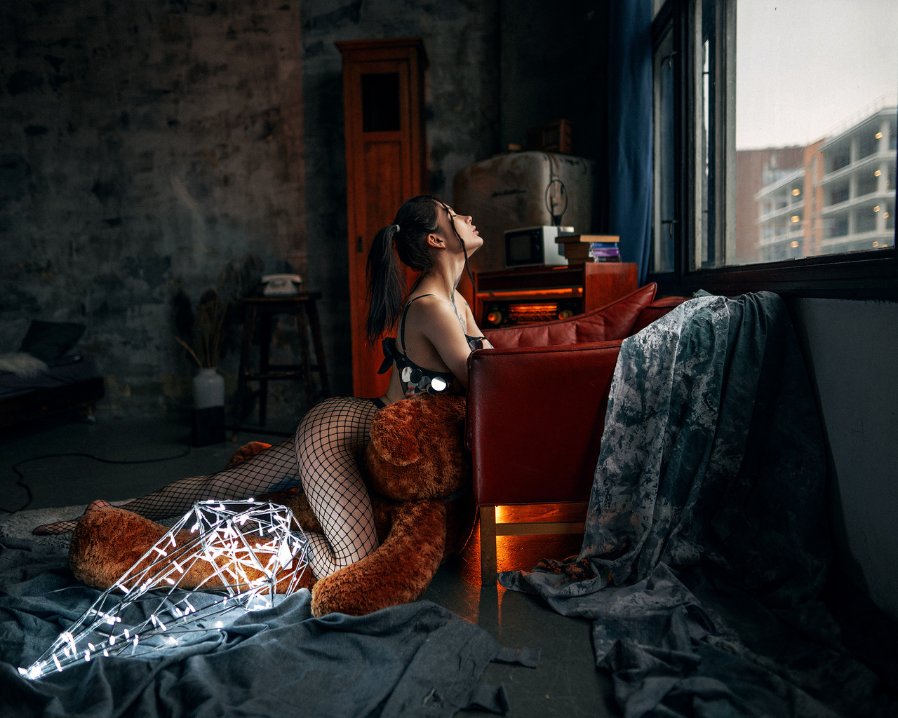 anastasia milkovich, women, fishnet, teddy bears, women indoors, tattoo, ass, closed eyes, ponytail, window, armchair, bed, pillow, black hair, books, bra, lingerie