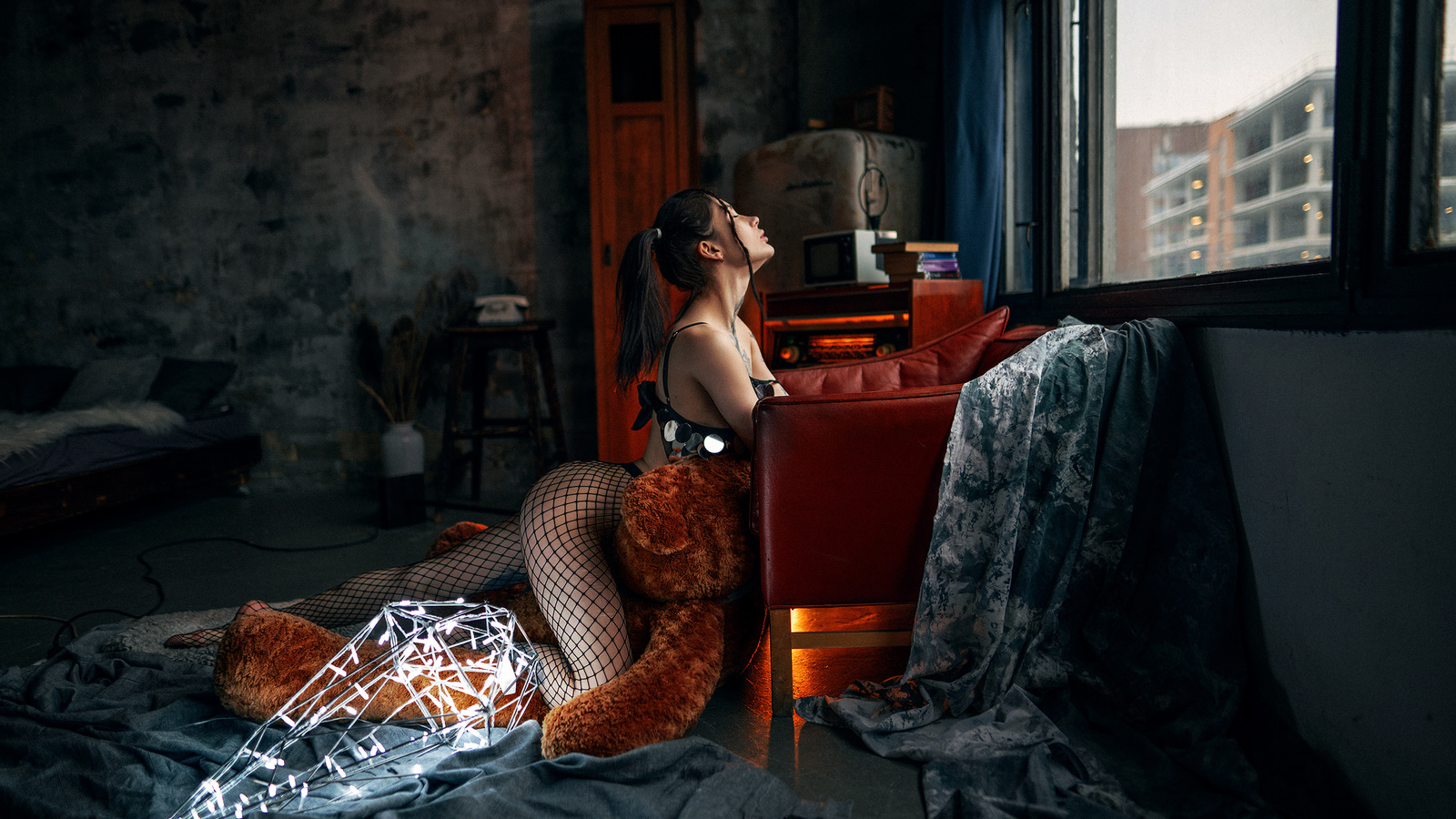 anastasia milkovich, women, fishnet, teddy bears, women indoors, tattoo, ass, closed eyes, ponytail, window, armchair, bed, pillow, black hair, books, bra, lingerie