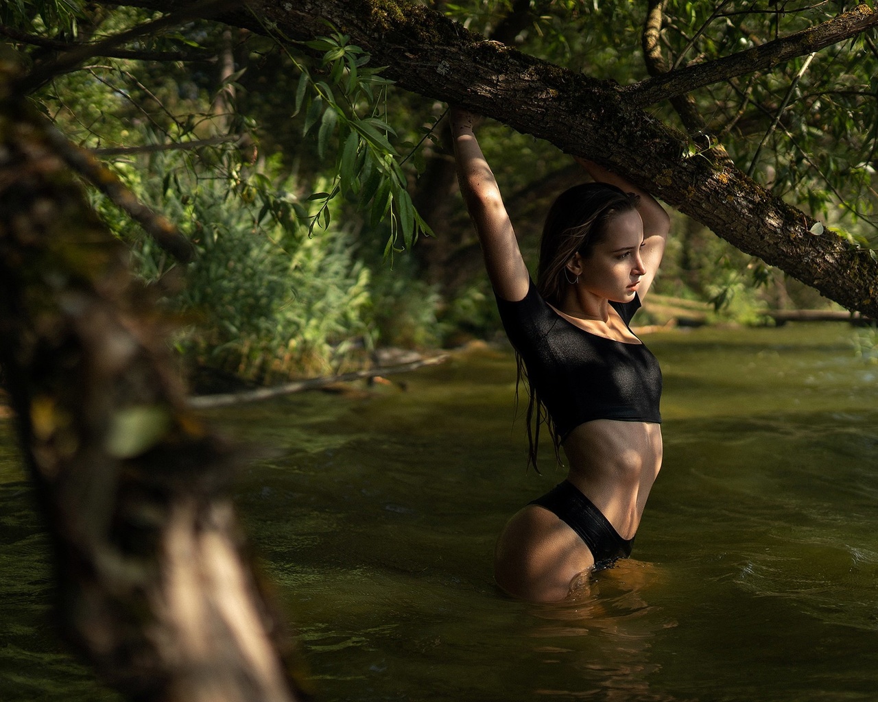 women, river, brunette, trees, women outdoors, wet body, black clothing, wet hair, arms up, ribs, belly