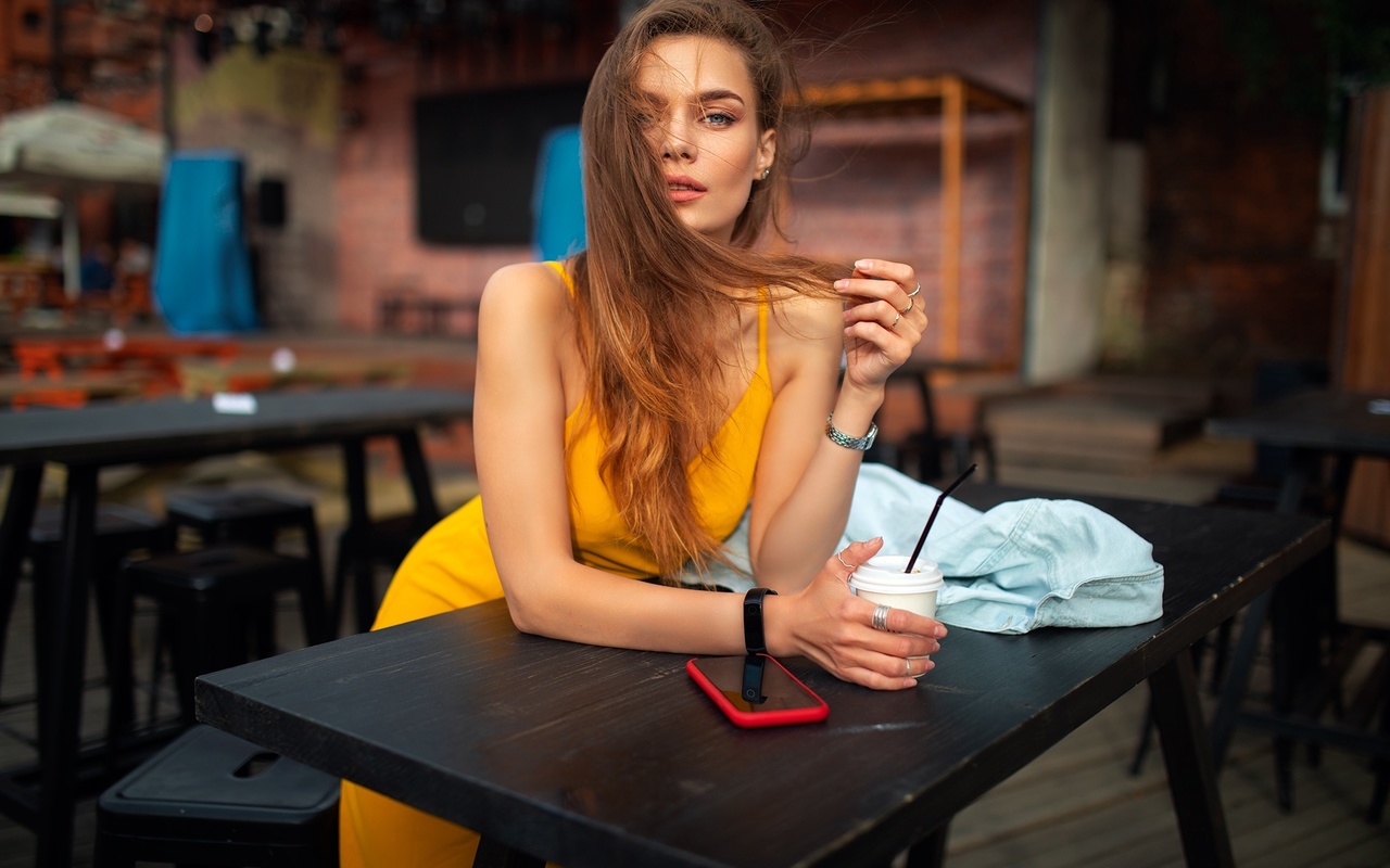 dmitry shulgin, women, model, blonde, women indoors, restaurant, yellow dress, dress, cellphone, smartphone, table, watch, bent over