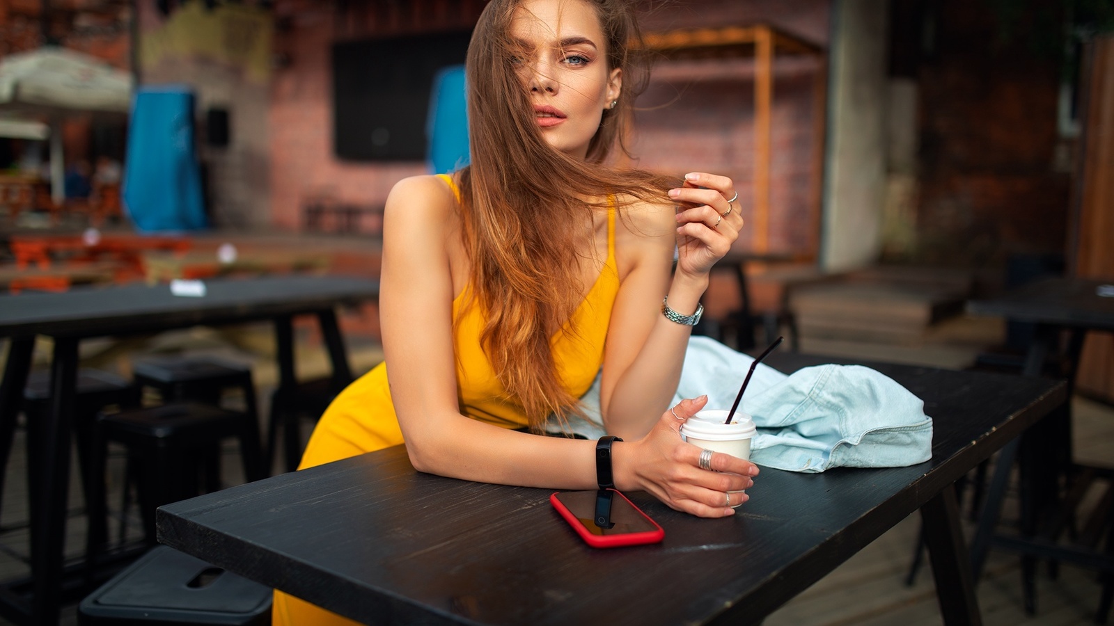 dmitry shulgin, women, model, blonde, women indoors, restaurant, yellow dress, dress, cellphone, smartphone, table, watch, bent over