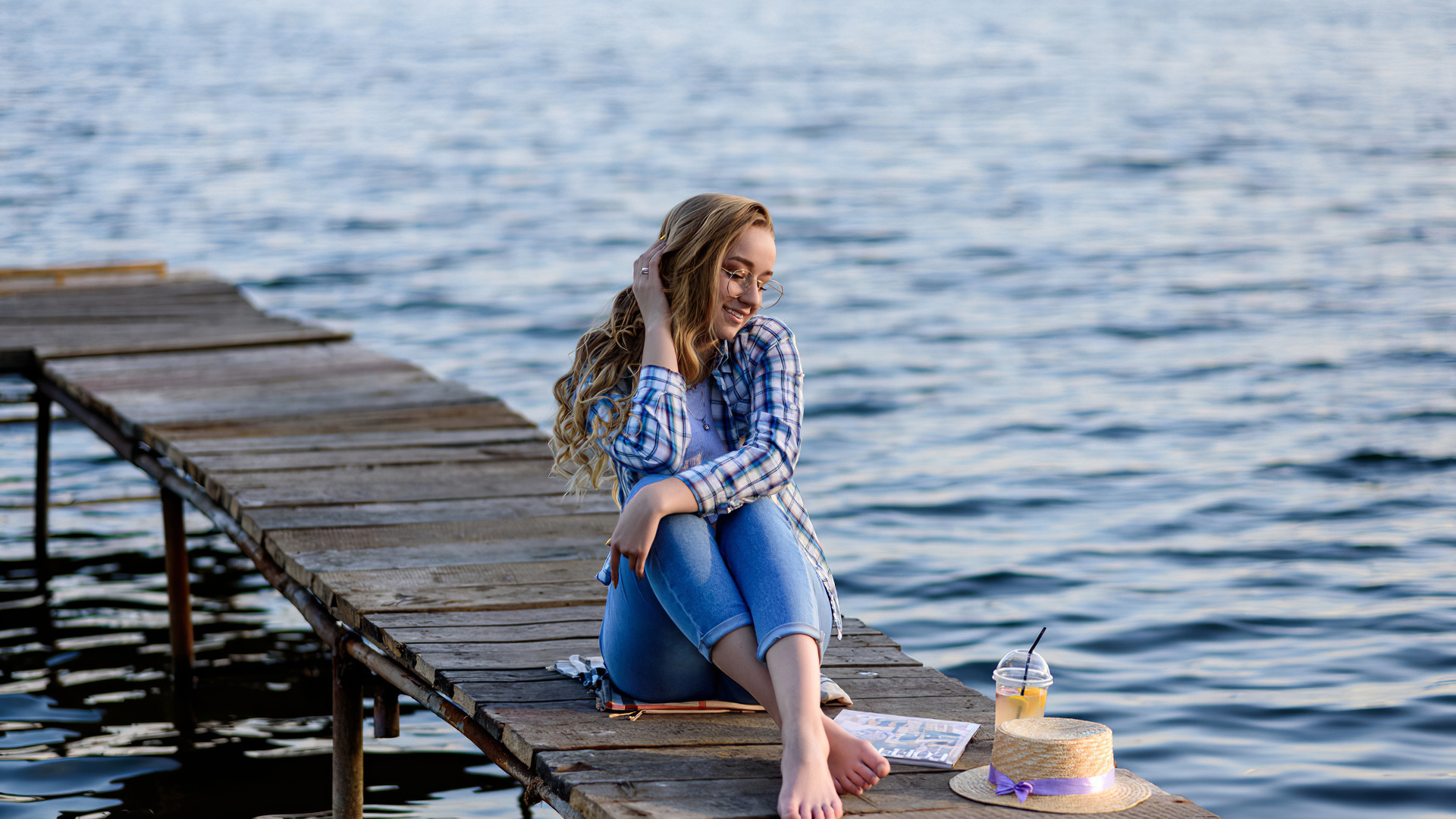 women, blonde, model, women outdoors, plaid shirt, jeans, hips, water, women with glasses, straw hat, lake, sitting