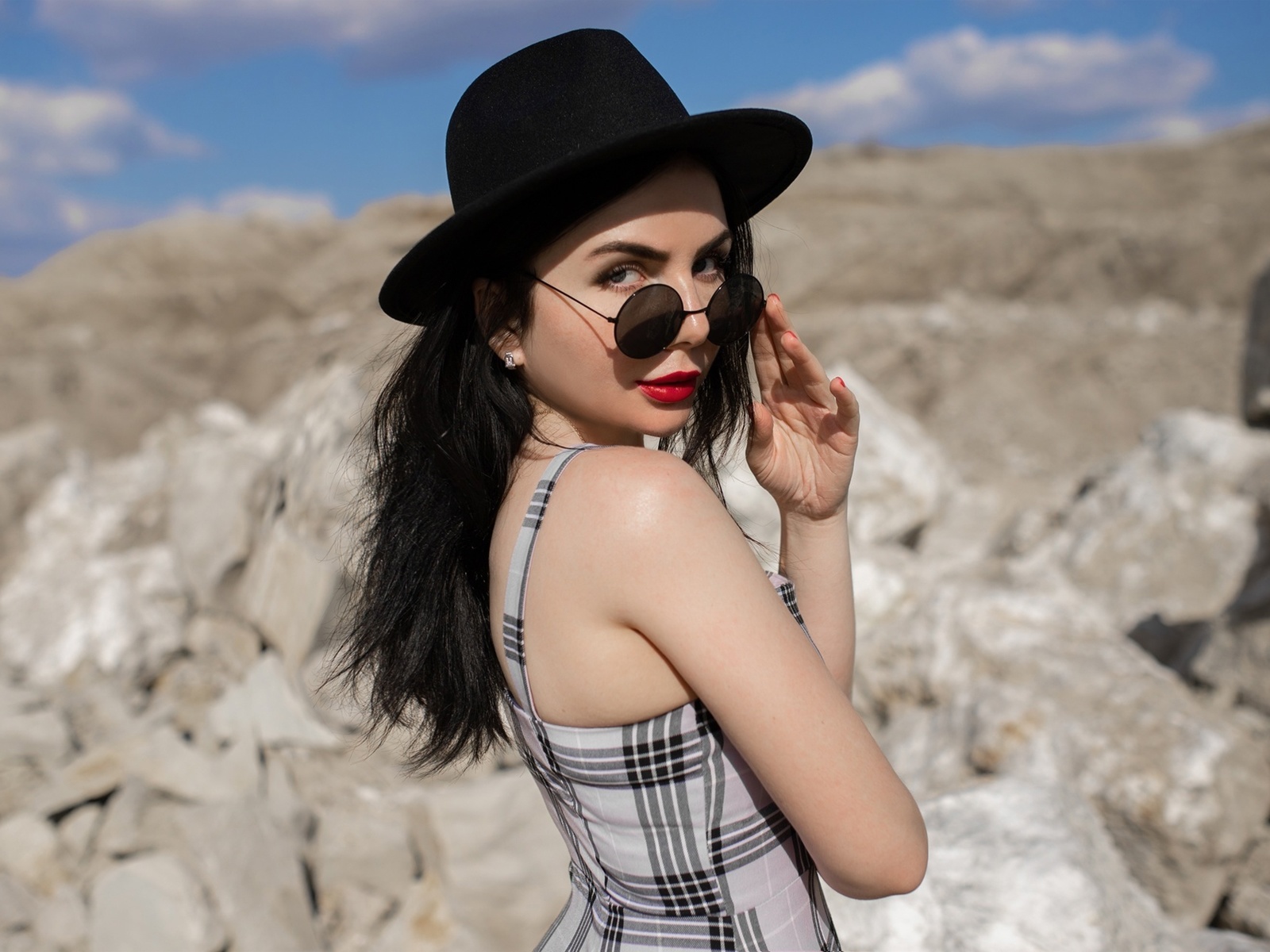 red lipstick, brunette, , women outdoors, sky, clouds, women with glasses, model, women with shades, rocks, dress, black hat