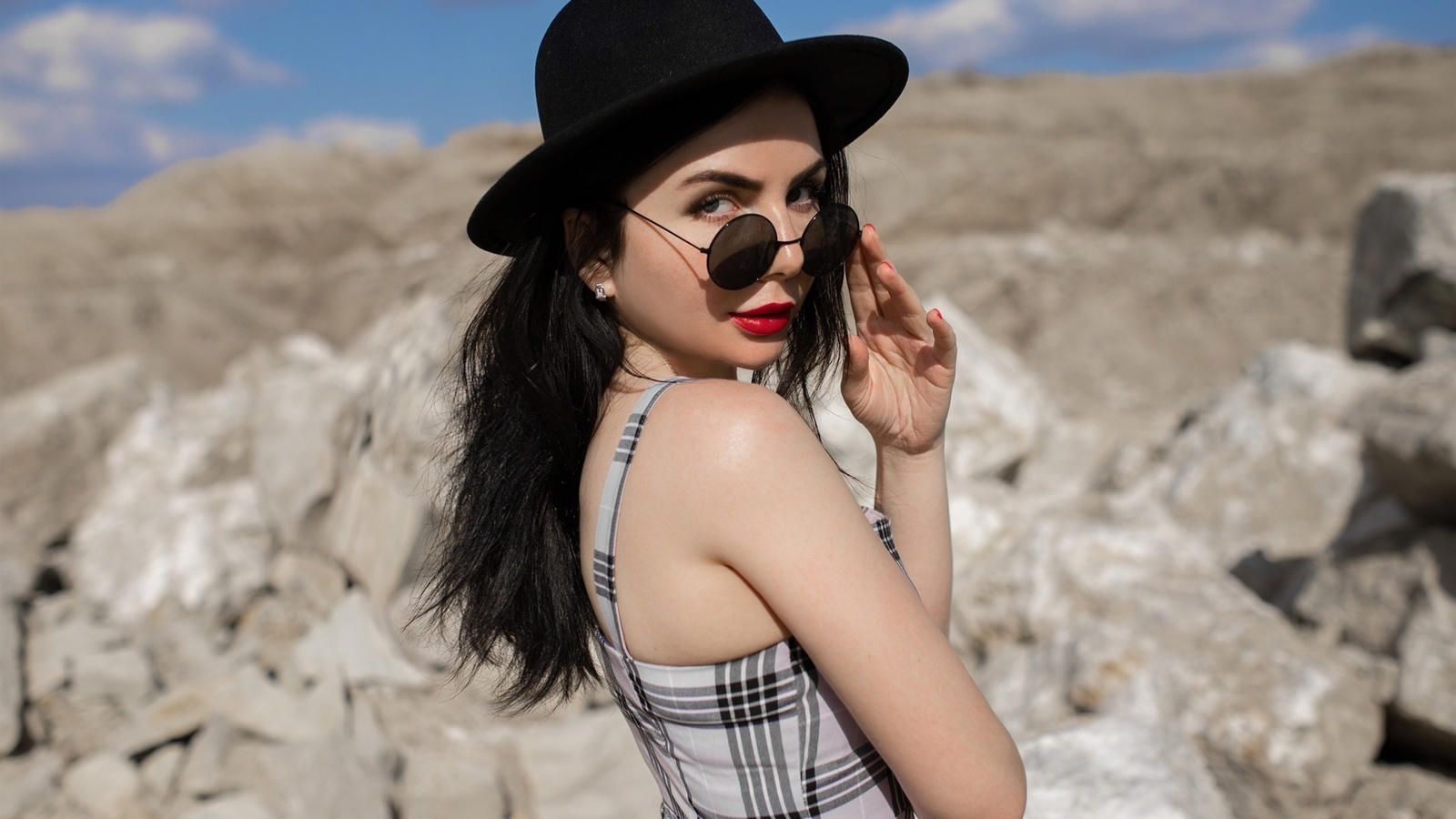 red lipstick, brunette, , women outdoors, sky, clouds, women with glasses, model, women with shades, rocks, dress, black hat