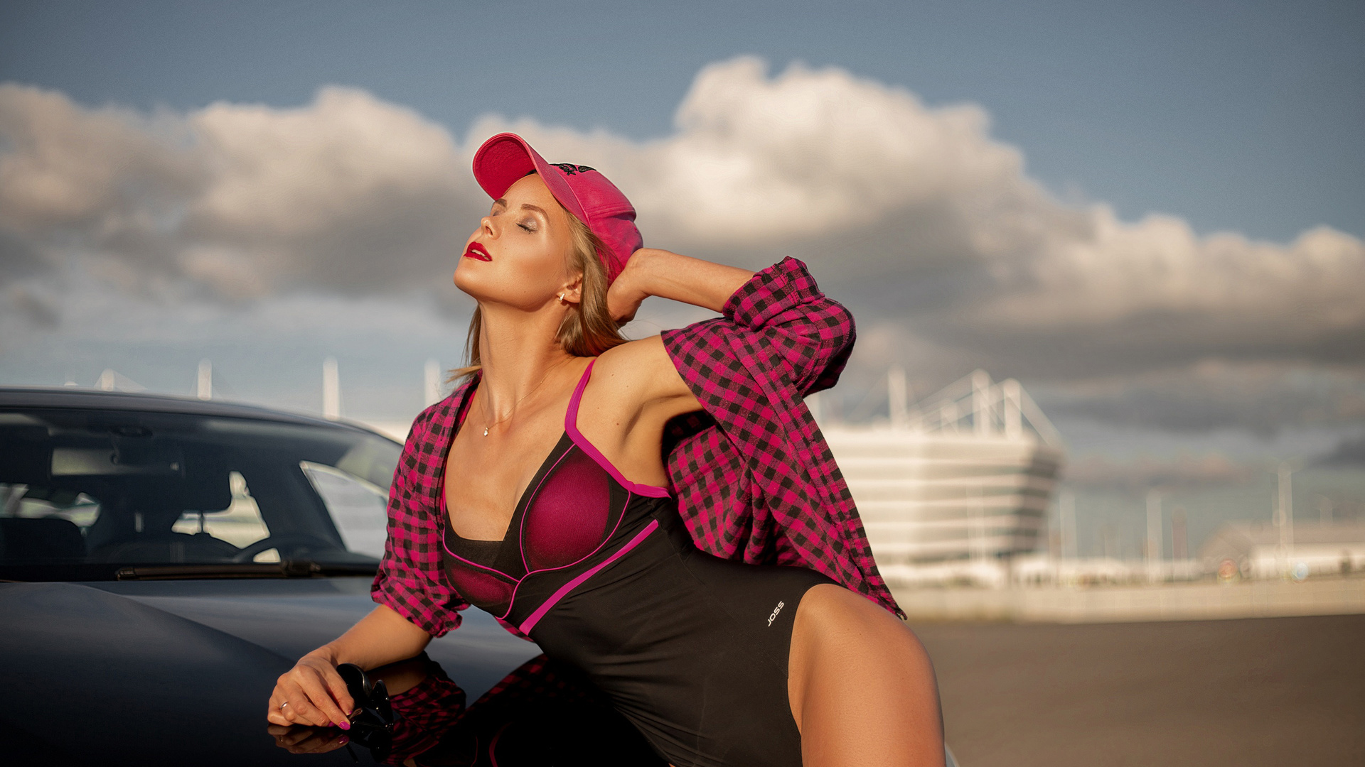 pink cap, bodysuit, , women outdoors, blonde, women with cars, hips, women, closed eyes, black cars, , model, sky, plaid shirt, clouds